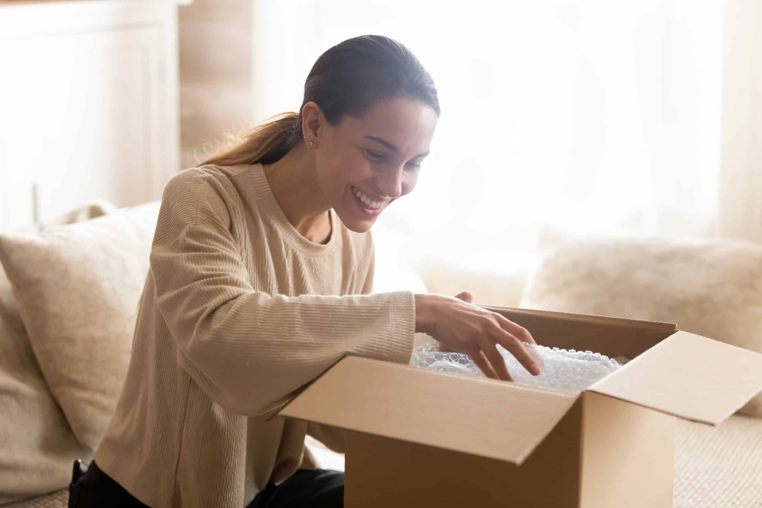 Happy Retail Customer opening an ecommerce box